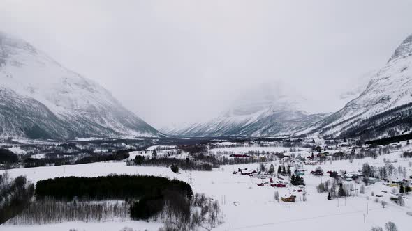 Winter landscape with high snowy mountains. Manndalen Norway. Frozen place. North alt