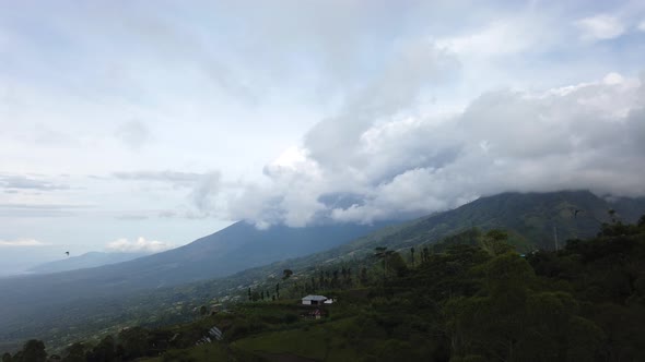 4K time lapse of Agung mount at daylight. Fluffy clouds run on blue sky over mountain Bali Indonesia