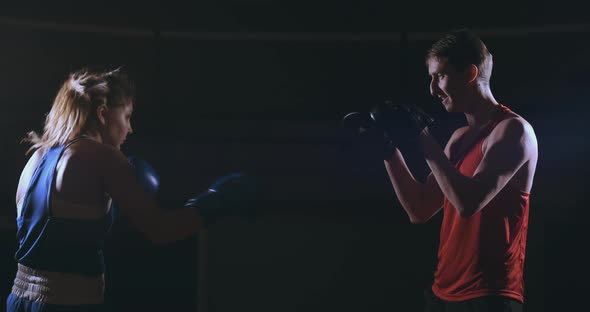 Fitness Woman Athlete Boxing Punching Focus Mitts Enjoying Intense Exercise Female Fighter Training alt