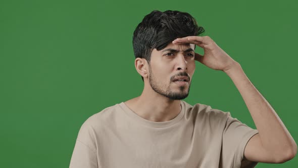Arabic Puzzled Man Stand on Green Background Brunette Male Portrait Hispanic Indian Guy Puts Hand to alt