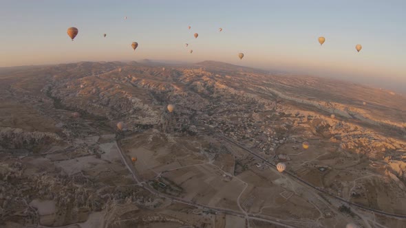 Cappadocia Aerial Shot of Rock Chimneys and Uchisar Castle in Goreme Turkey alt