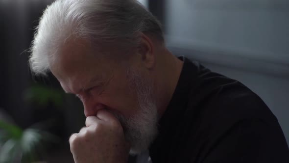 Closeup Face of Thoughtful Bearded Sad Worried Mature Adult Male Looking Away Thinking of Loneliness alt