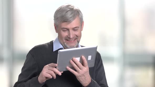 Smiling Caucasian Man Talking Via Internet. alt