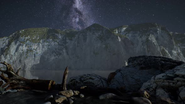 Hyperlapse of Night Starry Sky with Mountain and Ocean Beach in Lofoten Norway alt