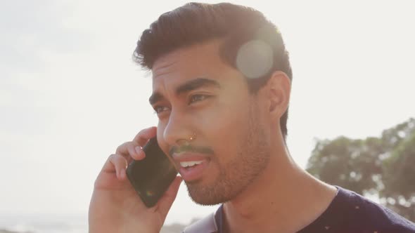 Young man talking on the phone alt