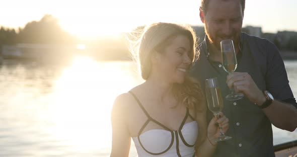 Happy Couple in Love Celebrate and Flirting Outdoor with Champagne