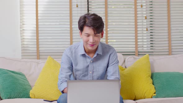 Entrepreneur handsome business asian man wear casual blue shirt working video call conference online alt