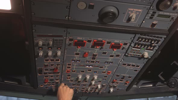 The Cockpit of the Aircraft. The Pilot Checks the Electronics of the Aircraft alt