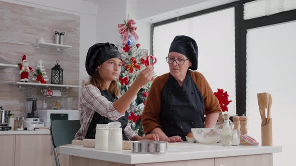 Grandchildren Wearing Apron While Preparing Delicious Homemade Gingerbread alt