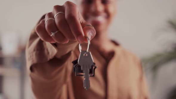 Young African American Woman Demonstrates Keys to House or Own Real Estate alt