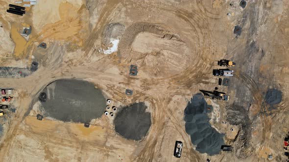 Construction of Aerial Top View on Industrial Equipment and Machinery Working Construction Land alt