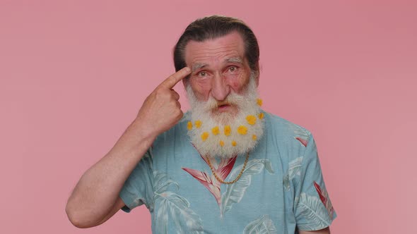 Senior Man Pointing at Camera and Showing Stupid Gesture Blaming Some Idiot for Insane Crazy Plan alt