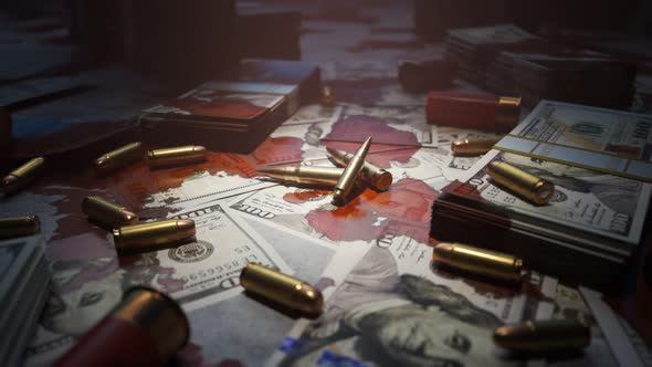 Few bullets lying on the table filled with dollar bills stained with blood. 4KHD alt
