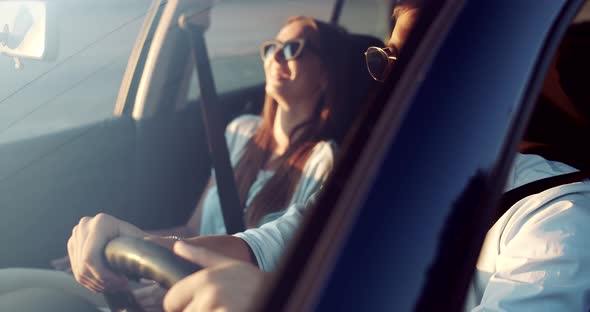 Couple Driving on Sunset