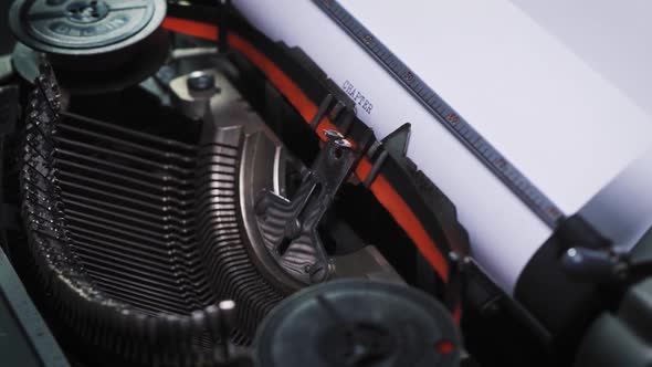Word Chapter on Paper in an Old Typewriter alt