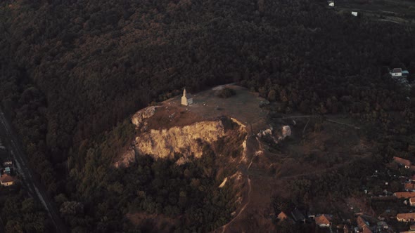 Wide Aerial view of Drazovce castle at sunset alt