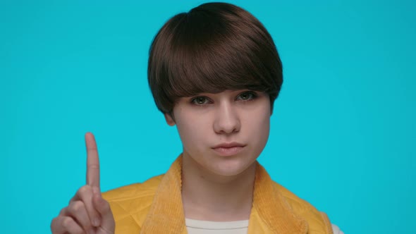 Woman Gesturing with Finger and Shaking Head for Saying No alt