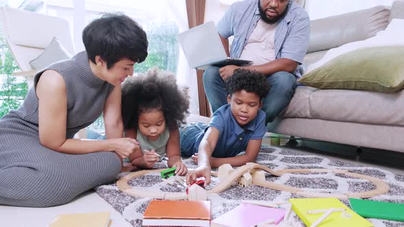 African American family in living room activity concept. Happy family togetherness