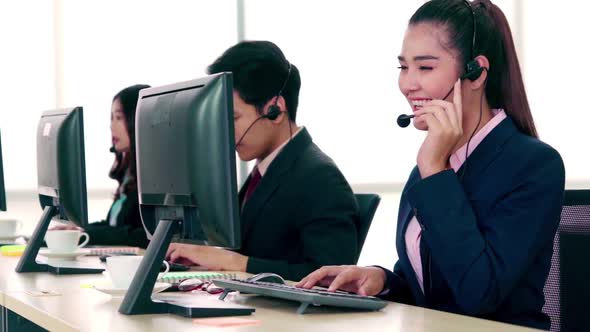 Business People Wearing Headset Working in Office alt