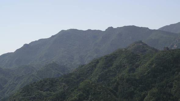 Panning shot of the mountains near the Great Wall of China at Badaling. alt