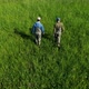 Fishermen Walking Through Green Meadow - VideoHive Item for Sale