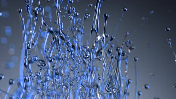 Super Slow Motion Shot of Splashing Blue Liquid on Gradient Background at 1000Fps alt