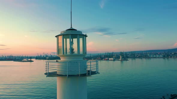 Drone Turns Around Lighthouse At Twilight During A Sunset 