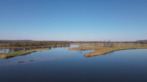 Autumn view of river ways in Wisconsin in autumn on a clear bright blue day. Reflections in water