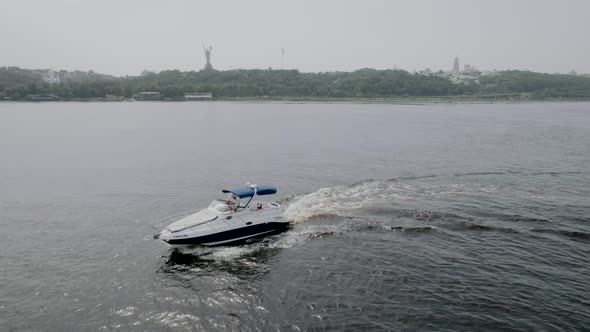 Motor Speedboat Floats on a Blue River