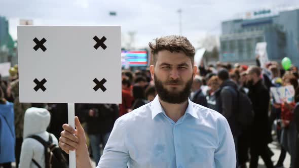 The Picket of a Man with a Banner in His Hands on Which You Can Place Your Logo. alt