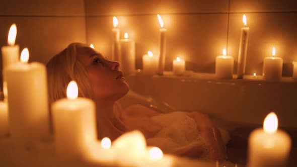 Relaxed Woman Washing Hands in Bath in Slow Motion alt