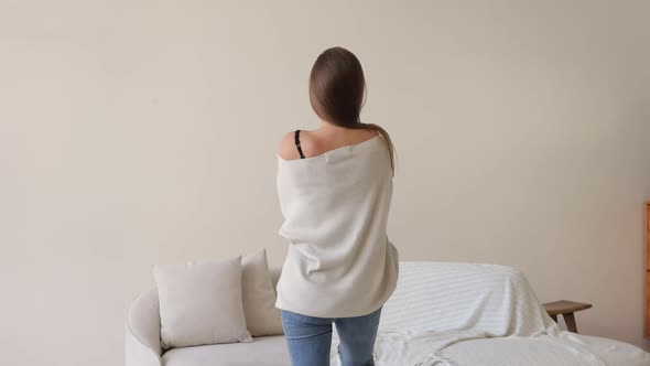 Sensual Female Taking Off Sweater