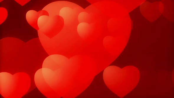 Abstract red hearts on dark background.