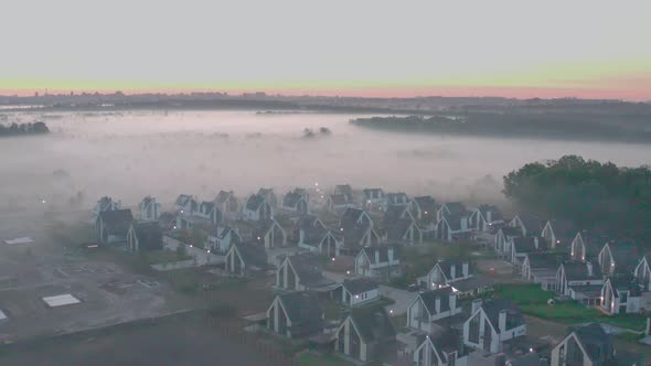 Townhouse at Dawn with Fog That Hangs in Layers. Light Haze. Oak Forest, Field