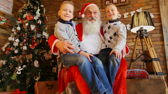 Two American Twin Brothers Whispering Desire on Santa's Ear