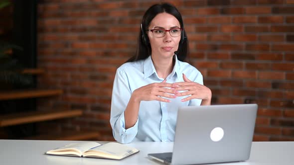 Friendly Beautiful Smart Caucasian Woman Wearing Glasses and Headset Support Employee Online alt