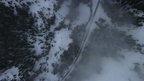 Overhead drone shot of foggy winding road near Crater Lake, Oregon, USA alt