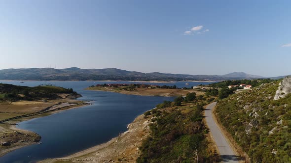 Car Traveling on Village Lake alt