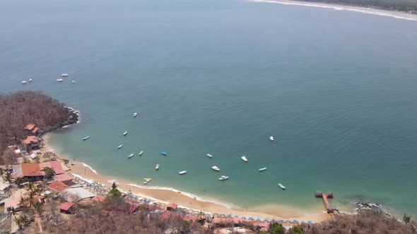 Drone flying over a long distance of Ixtapa beach located in the state of Guerrero, Mexico during a alt