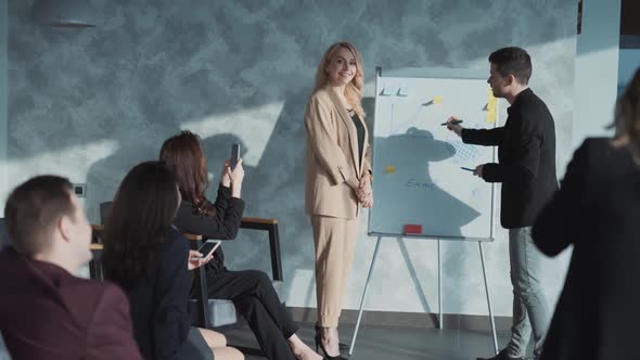 Group of Business Related Coworkers Wearing Suits Having Teambuilding Meeting and Conference alt