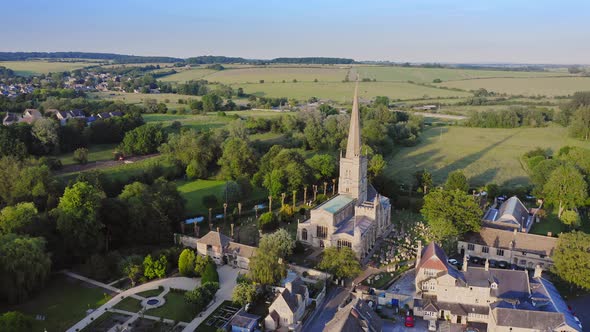 Aerial Drone View of Cotswolds Village and Burford Church in England, a Popular English Picturesque alt