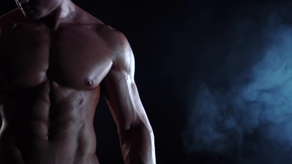 Athlete Lifts a Bar To Train for Competitions, Black Background, Slow Motion, Close Up alt