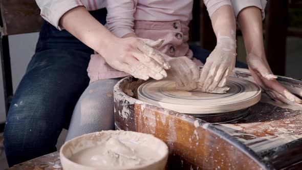 Mother and Daughter Making Ceramics in Workshop Studio