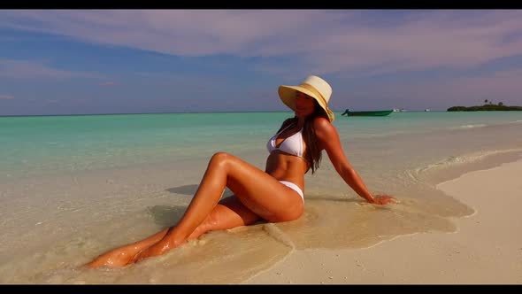 Female model tanning on paradise sea view beach adventure by blue green lagoon and white sandy backg alt