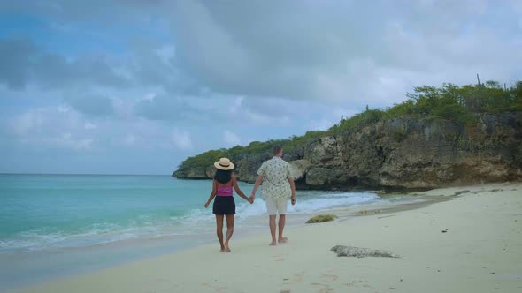 Couple Men and Woman Mid Age on the Beach of Curacao Grote Knip Beach Curacao Dutch Antilles alt