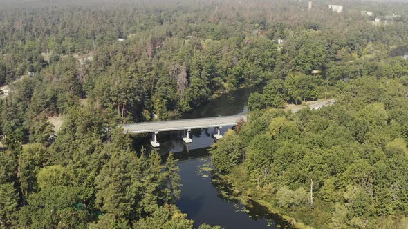  Road Bridge on the River Is Surrounded By Forests