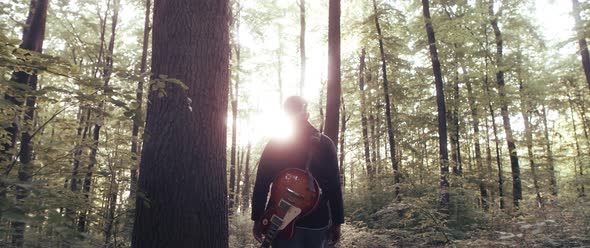Guitar Player in the Woods alt