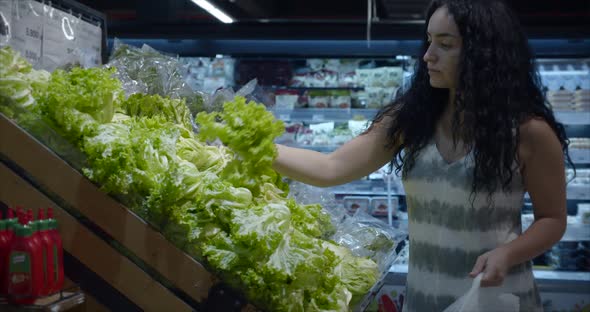 Girl Makes Purchases in the Supermarket, Healthy Food, Cabbage Salad in the Market, Supermarket alt