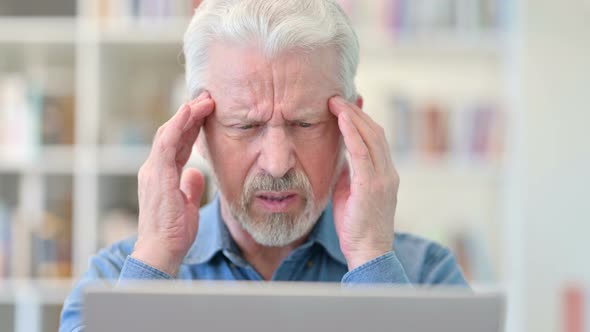 Close Up of Old Businessman Having Headache at Work alt