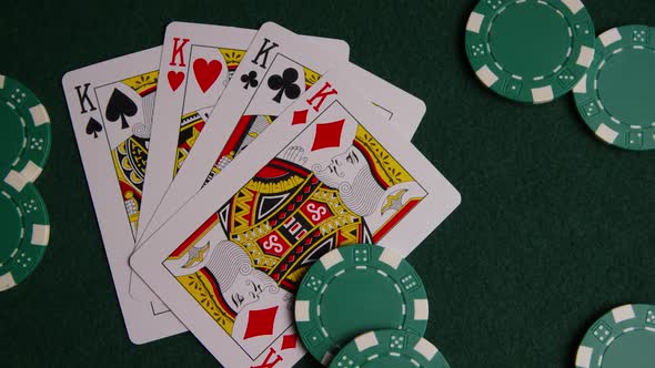Rotating shot of poker cards and poker chips on a green felt surface - POKER 010 alt